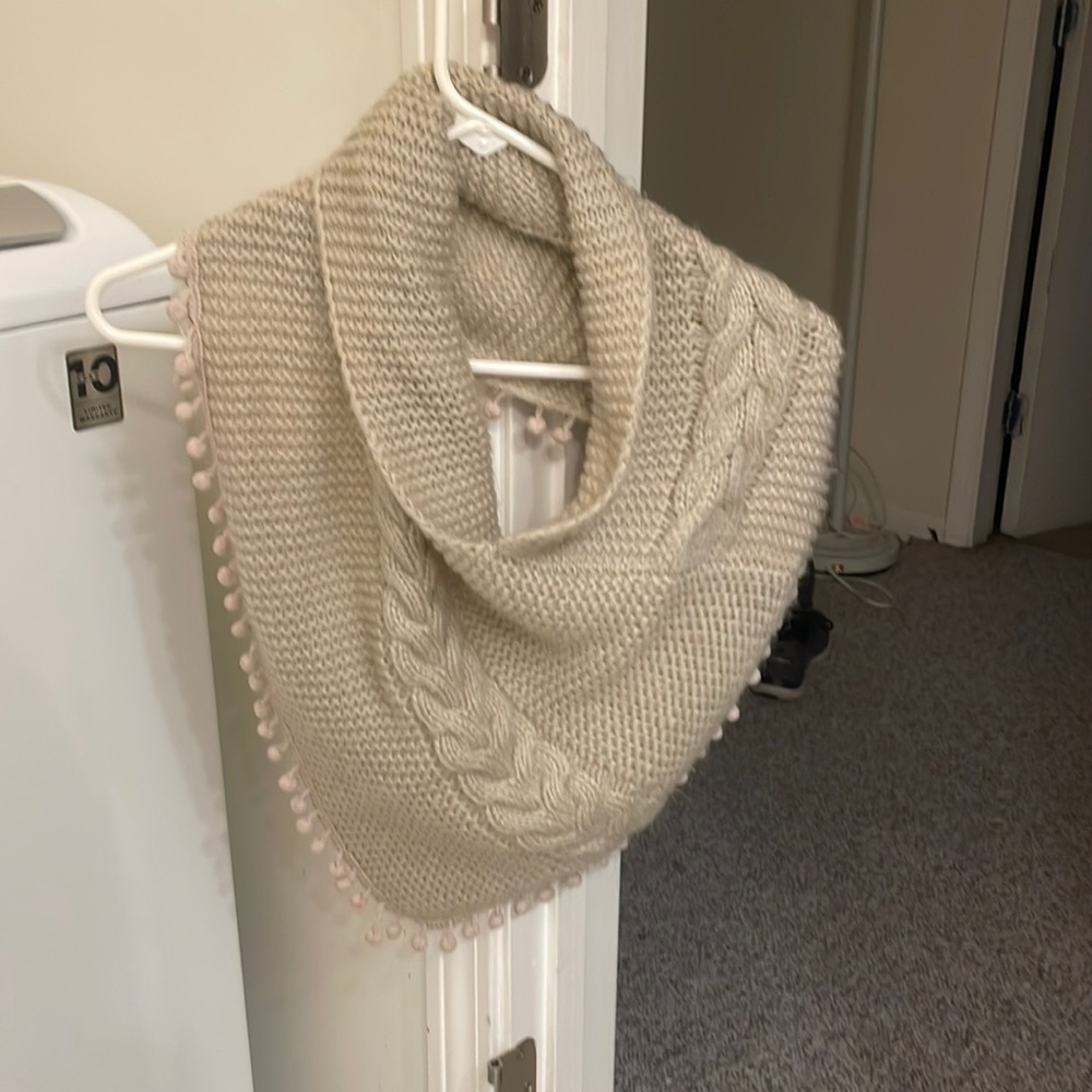 Knitted cream colored neck wrap